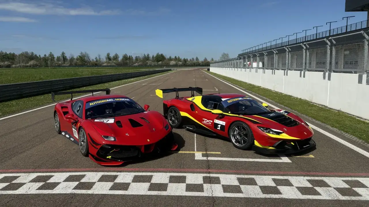 Two red Ferrari race cars, one with yellow accents, are parked on a checkered finish line. This is a prime example of dynamic racing photography.