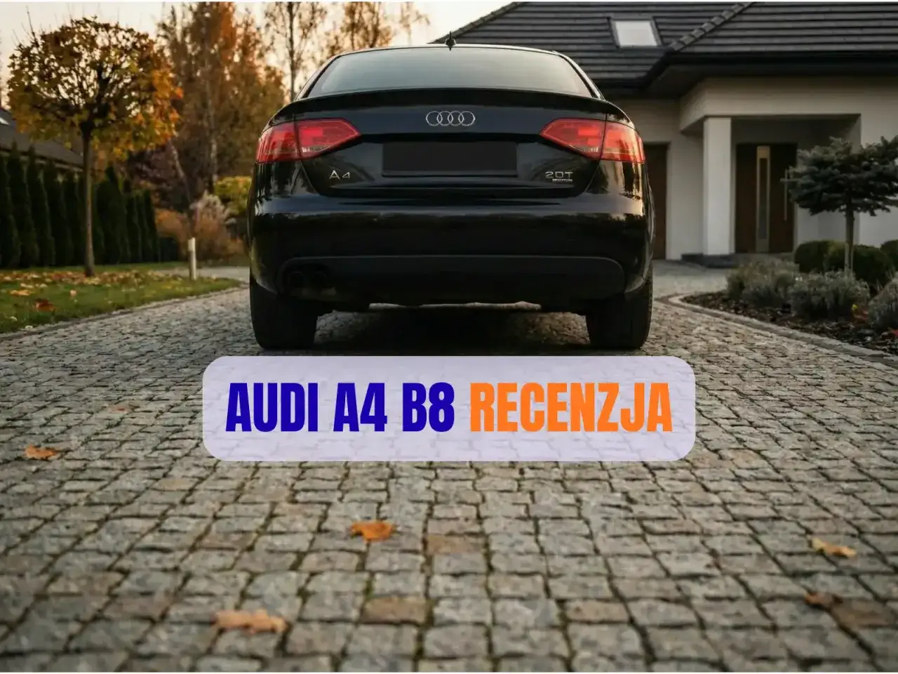 Czarne Audi A4 B8 na podjeździe. Recenzja omawia typowe usterki tego modelu, pomagając potencjalnym nabywcom.
