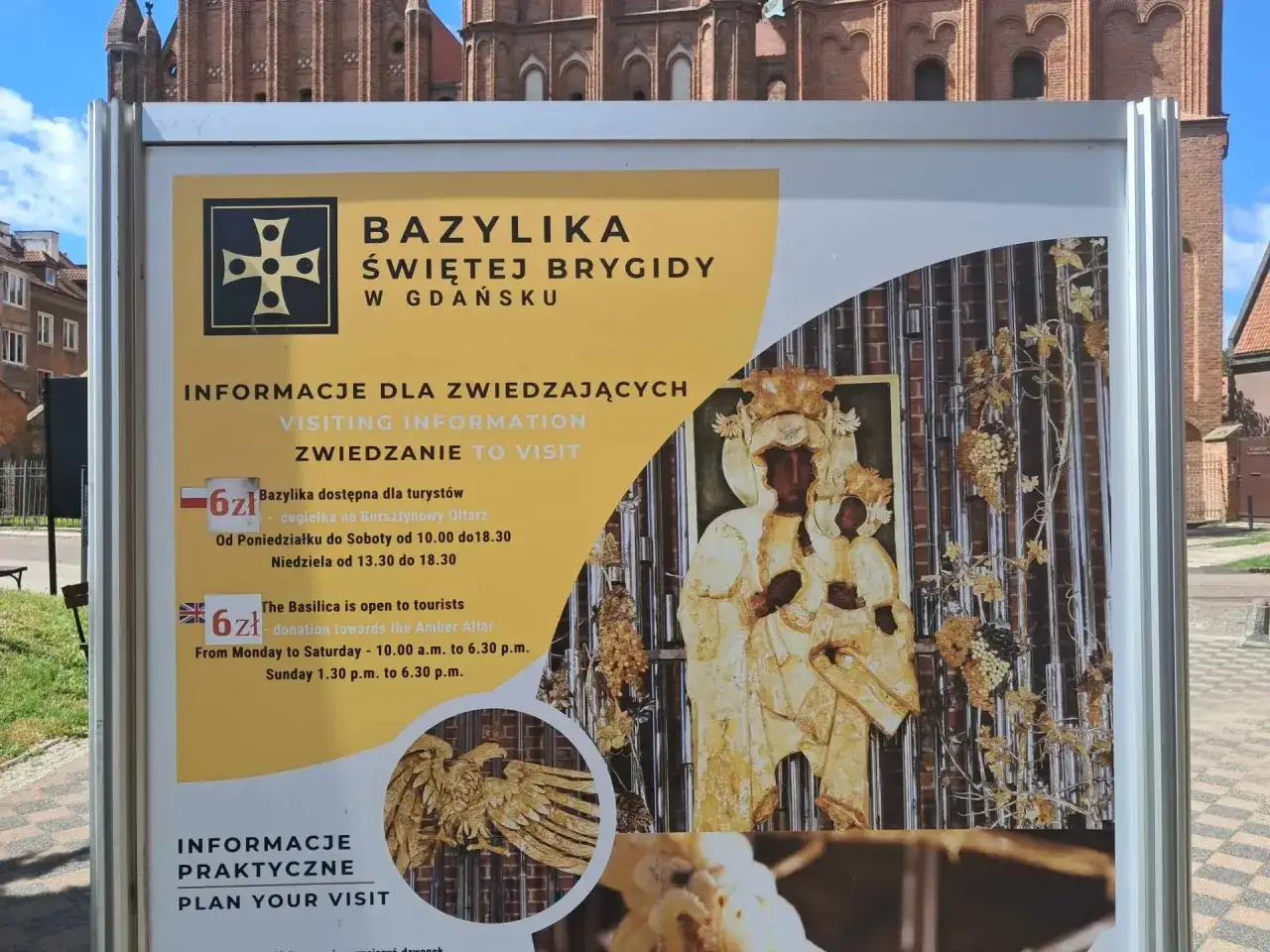 Tablica informacyjna Bazyliki św. Brygidy w Gdańsku. Pod wezwaniem skrót 