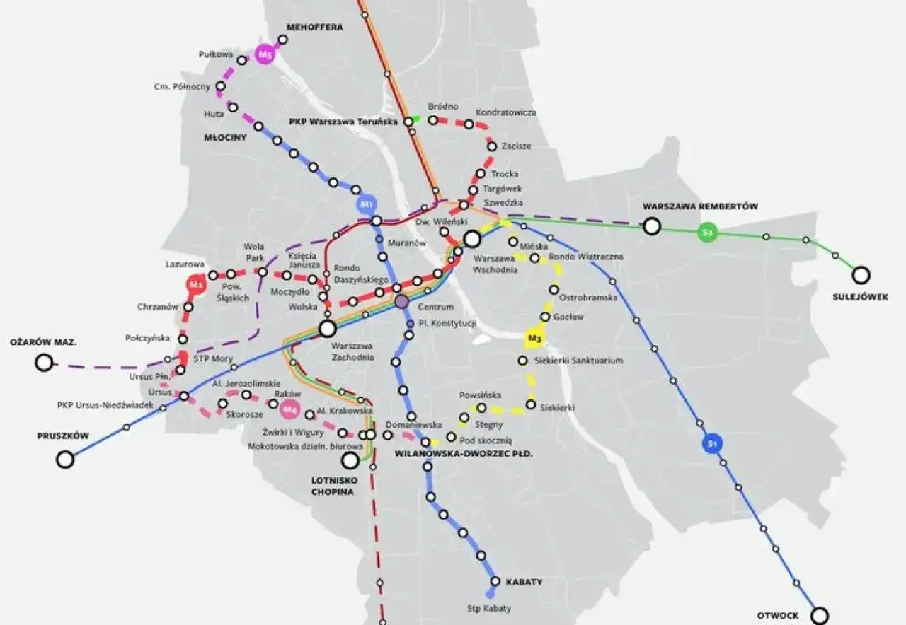 Mapa metra w Warszawie z zaznaczonymi liniami M1, M2, M3, M4, S1, S2, S3 i S4. Widoczne stacje i nazwy dzielnic.