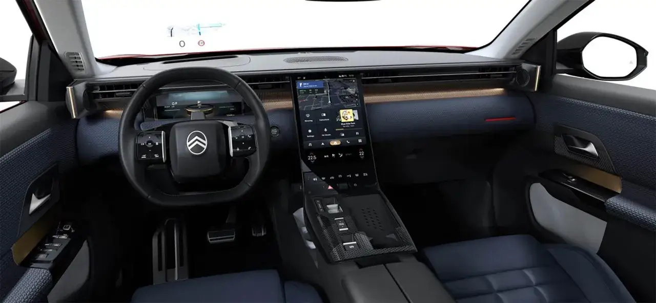 Wnętrze Citroëna C5 Aircross 2025 z dużym ekranem dotykowym, cyfrowymi zegarami i nowoczesną konsolą środkową.