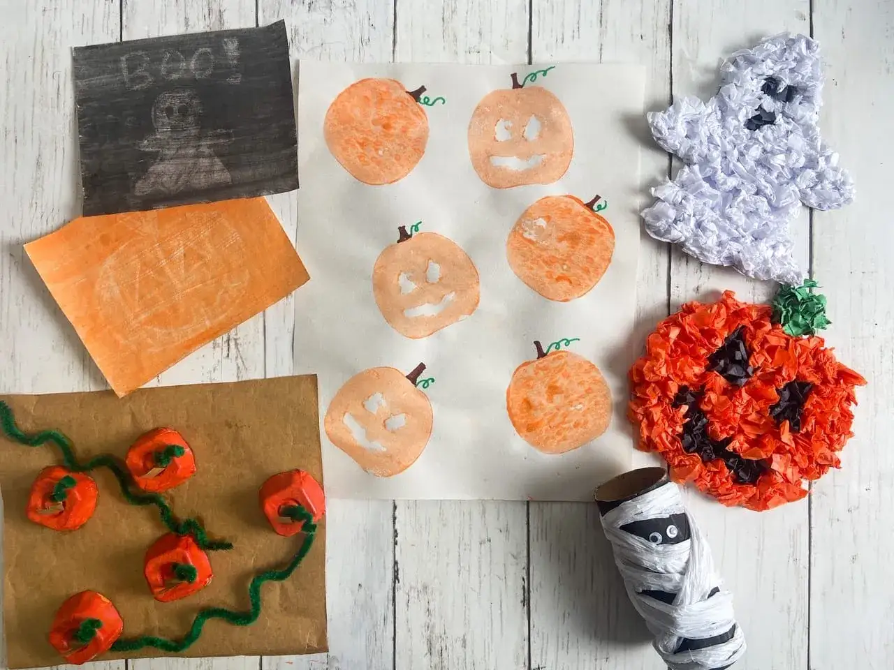 Halloween pyssel sm&aring; barn: pumpafigurer, sp&ouml;ke av papper och en mumie av toarulle.