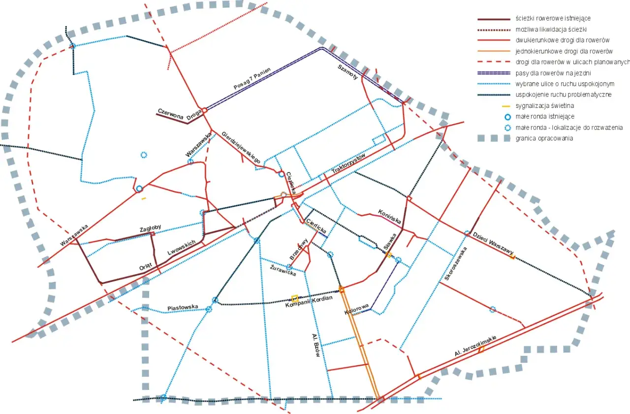 Mapa tras rowerowych w Warszawie z zaznaczonymi ścieżkami, drogami i rondami.
