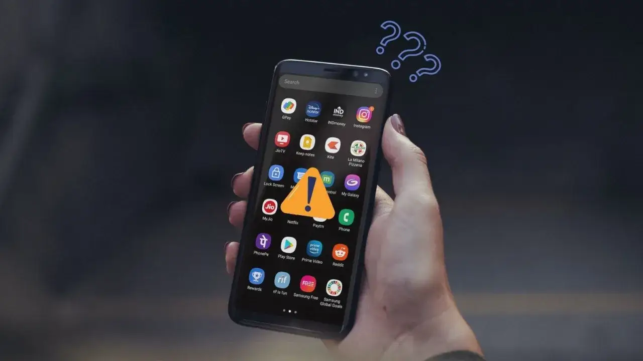 Zastanawiasz się, jak pobierać płatne aplikacje za darmo na Androida? Na ekranie telefonu widoczny jest wykrzyknik i znaki zapytania.