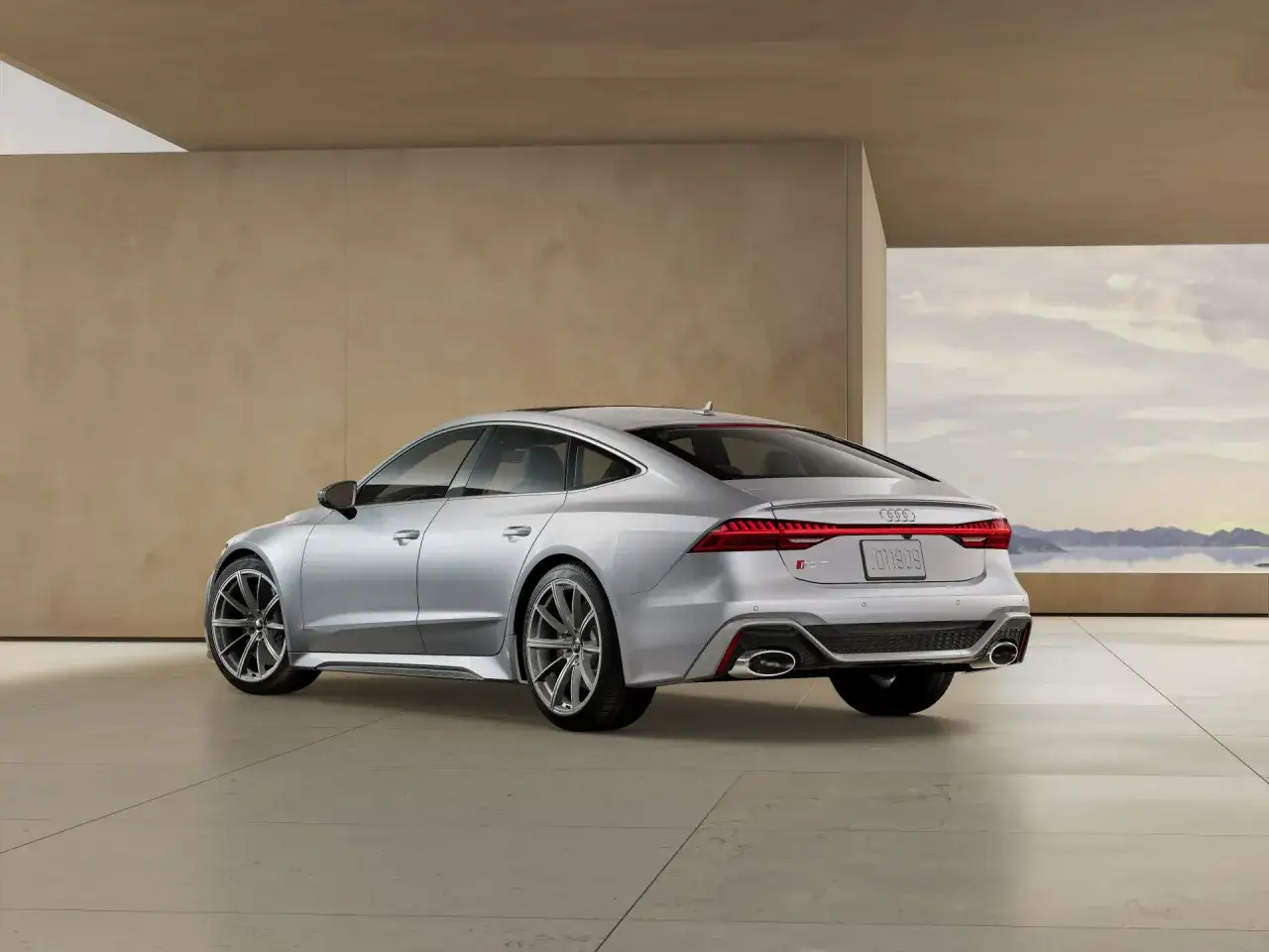 Srebrne Audi RS7 Sportback z imponującym tyłem i sportowymi detalami. Sprawdź audi rs7 cena i możliwości tego auta.