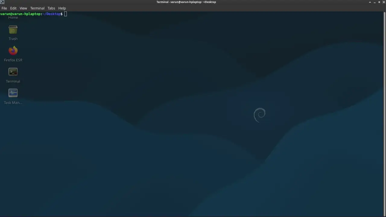 Pulpit systemu Debian 10 z ikonami: Kosz, Firefox ESR, Terminal, Menedżer zadań.