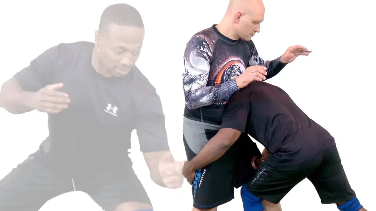 Tv&aring; m&auml;n i en position f&ouml;r catch wrestling. Den ena mannen, med bar &ouml;verkropp, h&aring;ller den andra mannen i ett grepp.