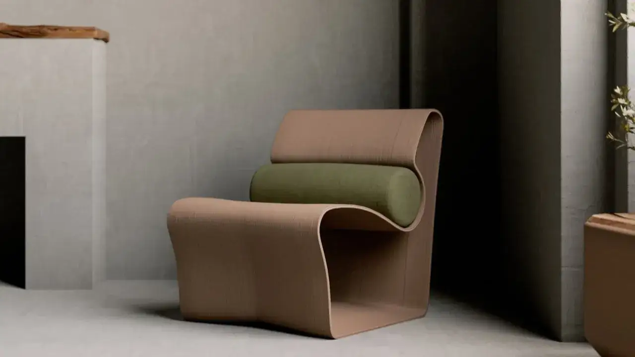 Nowoczesne meble do druku 3D: designerski fotel o falistym kształcie z zieloną poduszką, w minimalistycznym wnętrzu.