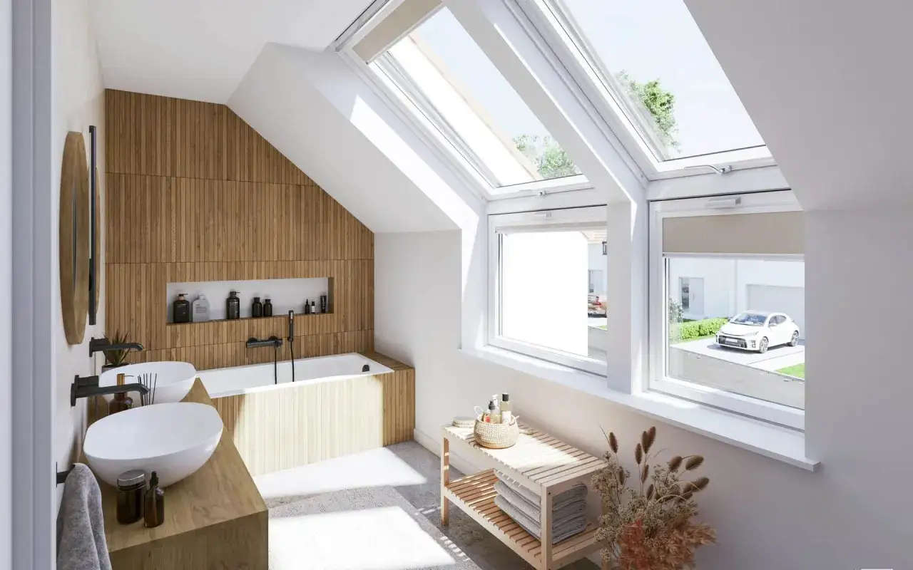 &Eacute;l&eacute;gante petite salle de bain mansard&eacute;e avec murs en bois, baignoire, deux lavabos et de grandes fen&ecirc;tres de toit baignant la pi&egrave;ce de lumi&egrave;re naturelle.