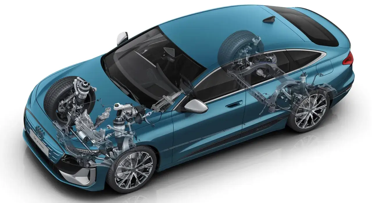 Audi A6 e-tron z widocznym zawieszeniem i elementami układu napędowego.