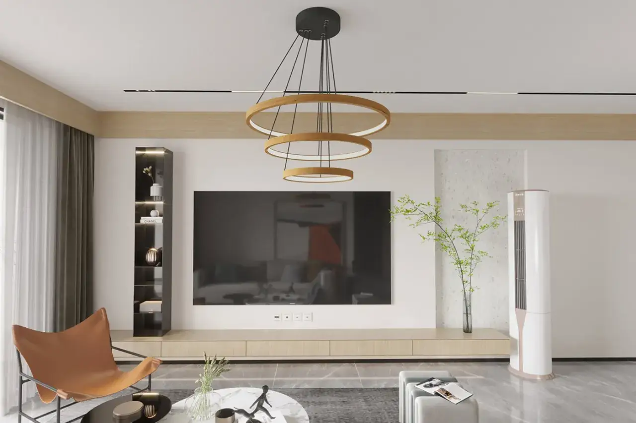 Nowoczesne aranżacje salonu: designerska lampa, duży telewizor, wygodny fotel i elegancka szafka.