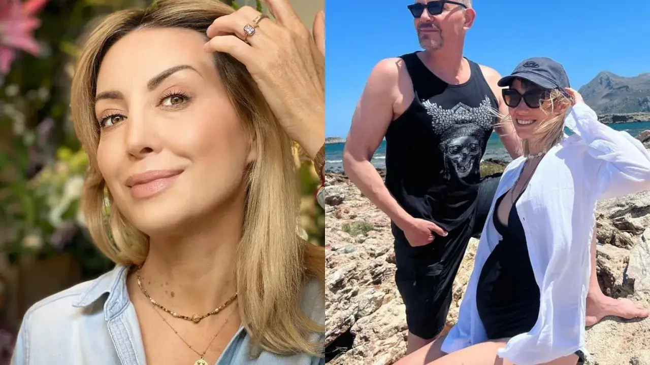 Anna Zejdler z mężem na wakacjach. Uśmiechnięta para pozuje na tle morza i skał.