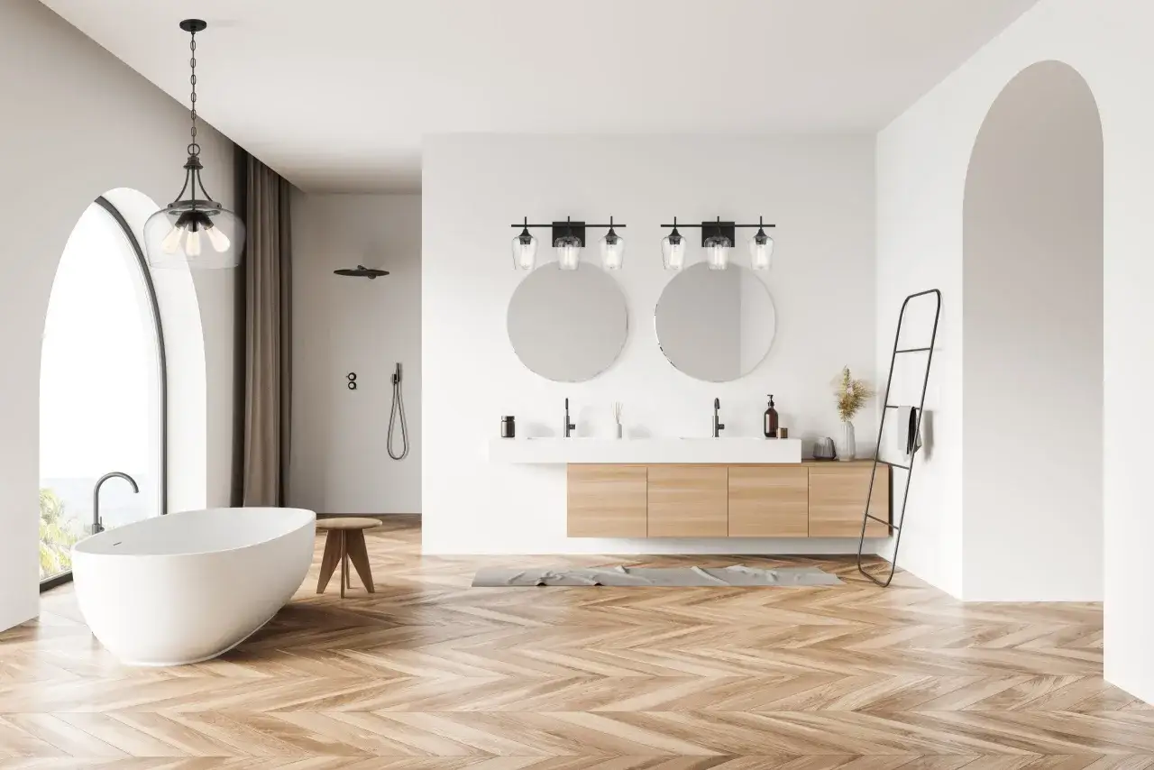 Modern bathroom with a freestanding tub, dual sinks, and a vanity light fixture above the mirrors, perfect for an 8 ft ceiling.