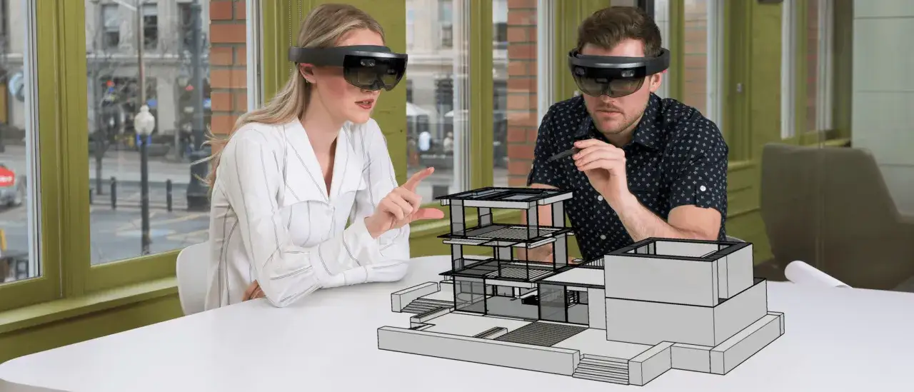 Architekci w goglach AR analizują projekt domu, co pokazuje, co to jest VR w praktyce.