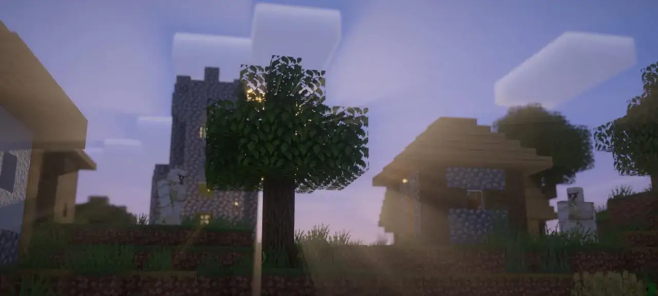 Wieś w Minecraft z vanilla plus shaders. Słońce przebija się przez drzewa, oświetlając kamienne domy i golema.