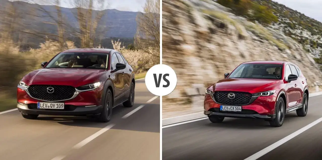 Dwa czerwone SUV-y Mazda CX jadące po krętych drogach.