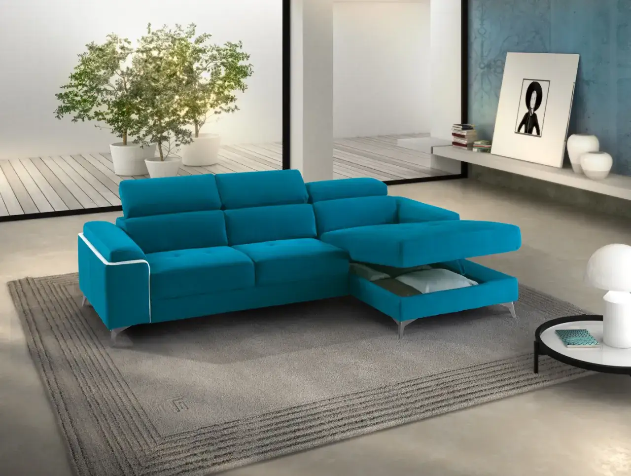Divano letto angolare blu turchese con chaise longue estraibile, ideale per ottimizzare lo spazio. La sua lunghezza da aperto è perfetta per ospitare comodamente.