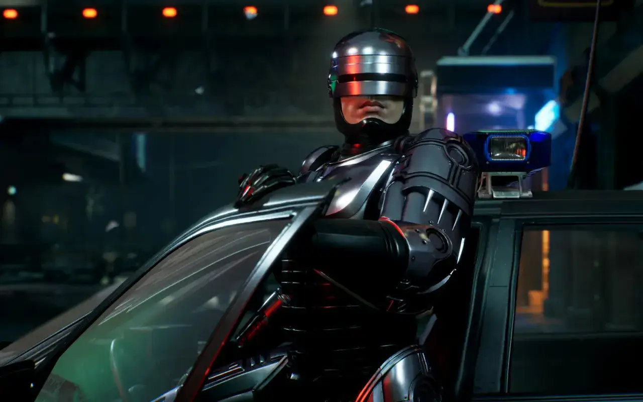 RoboCop w zbroi opiera się o samochód, gotowy do akcji w grze RoboCop: Rogue City.