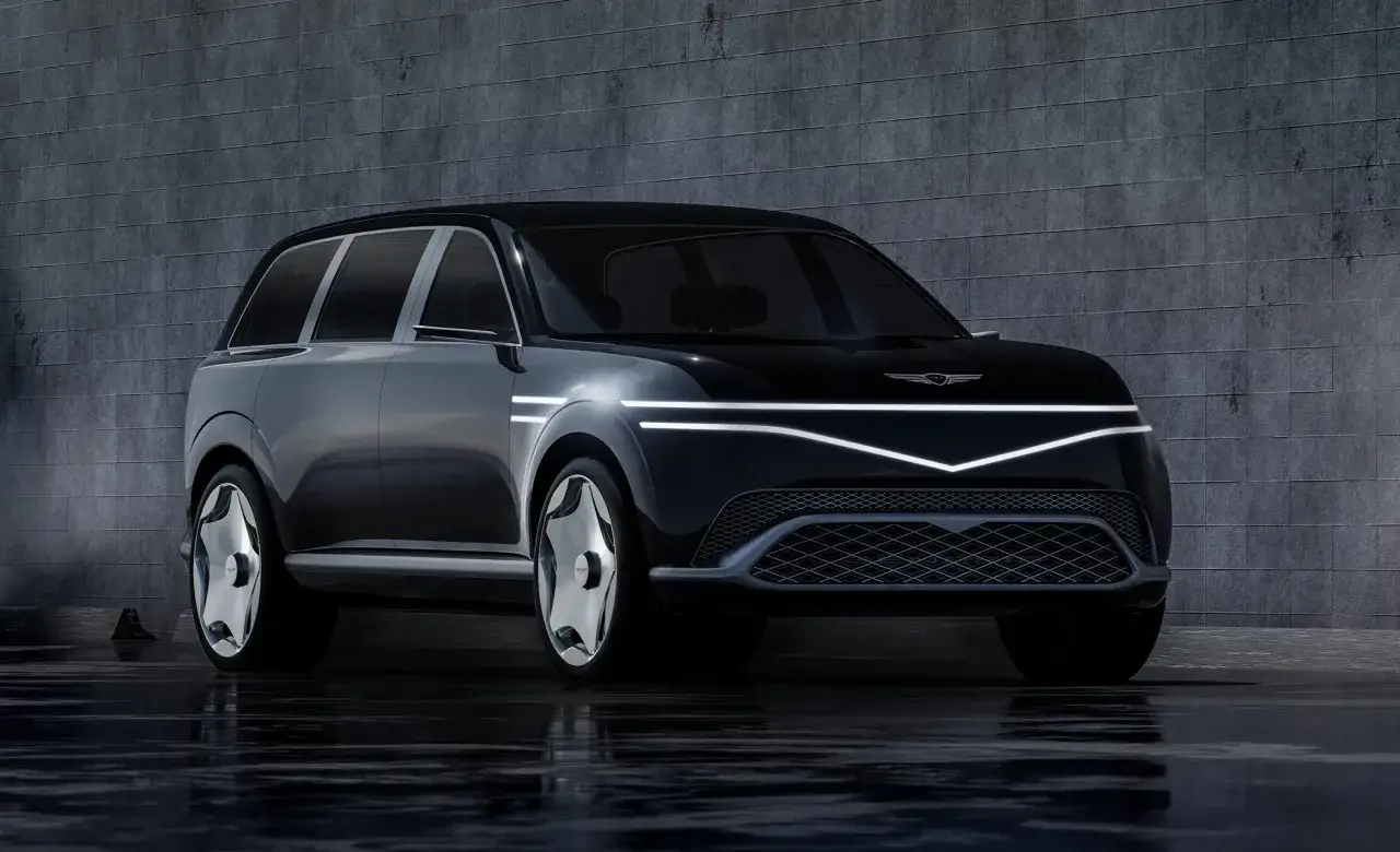 Un'elegante concept car nera, un SUV futuristico, riflette su una superficie bagnata. Il design distintivo, con luci a LED a forma di V, evoca un'atmosfera di lusso e innovazione, come un'anticipazione del futuro, forse un modello **lepas l6**.