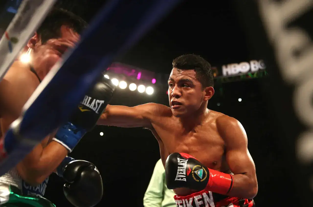 Nicaraguan boxers in action, sweat glistening as they exchange powerful blows in the ring.