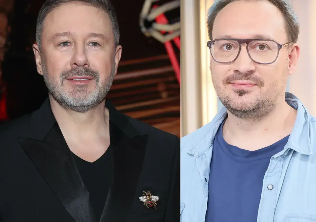 Andrzej Piaseczny z partnerem, obaj uśmiechnięci.