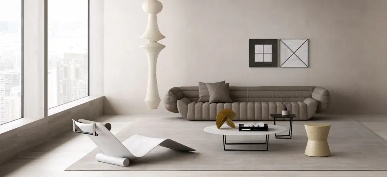 Un angolo di casa moderno con divano imbottito, chaise longue scultorea, tavolino e lampada a sospensione.