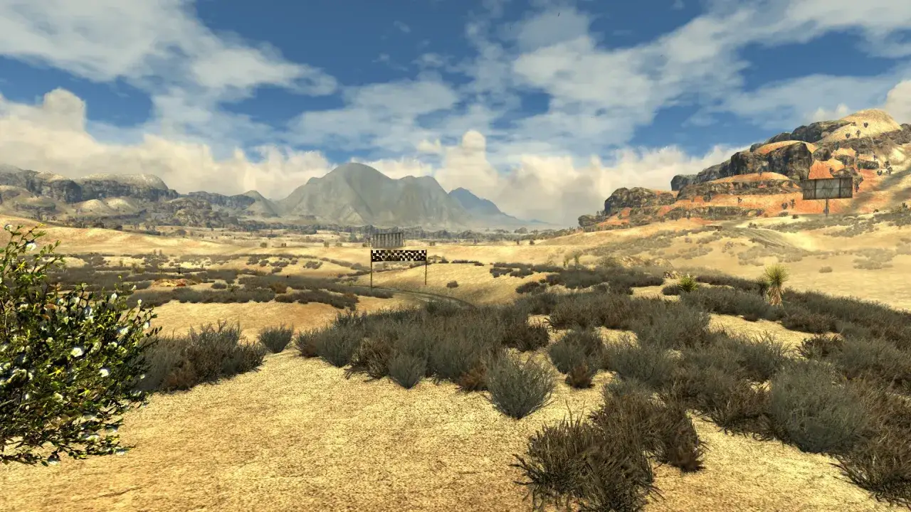 Paisaje desértico con montañas al fondo y una meta de carreras. Un vistazo a **Fallout New Vegas Remastered**.