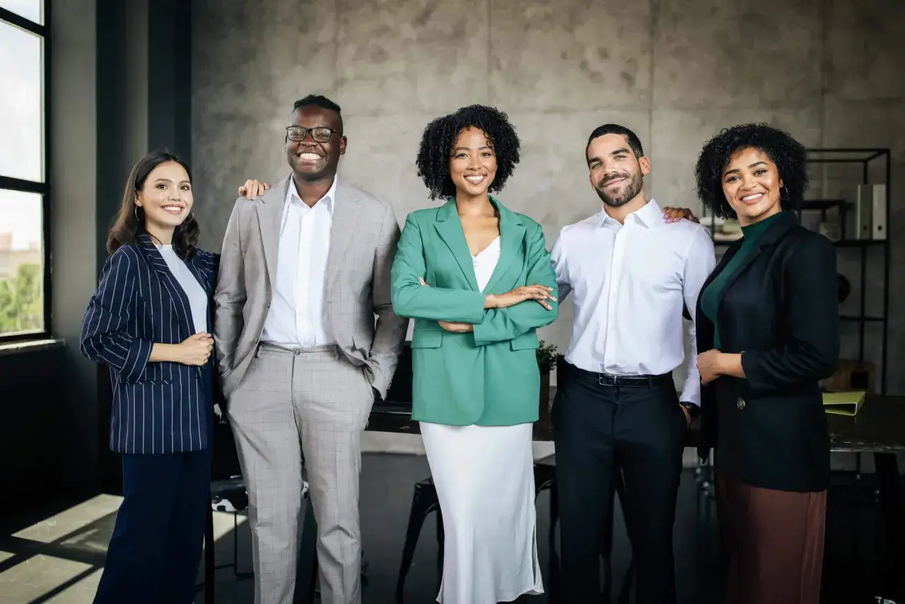 A diverse team of five professionals stands together, showcasing their collective strengths.