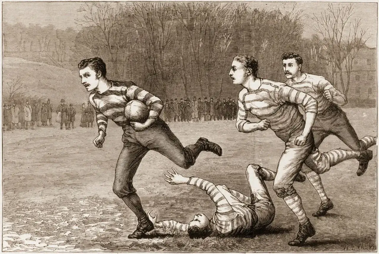 Mężczyźni w pasiastych strojach grają w rugby. Kto wymyślił piłkę nożną? To pytanie pozostaje bez odpowiedzi, ale ta gra jest ekscytująca!