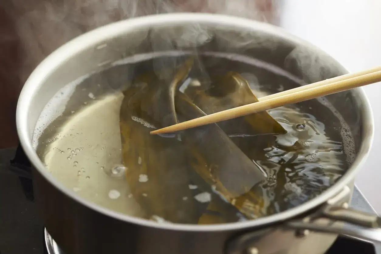 Kombu is simmered in a pot, releasing its umami flavor for delicious kombu recipes.