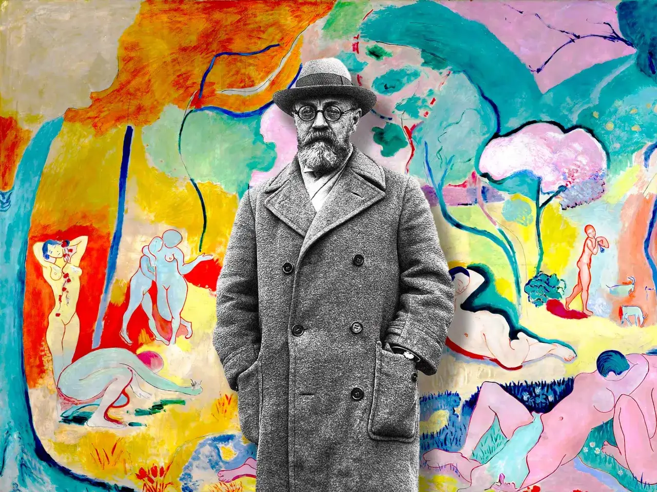 Henri Matisse, surrounded by his vibrant, colorful obras, stands in a grey coat.