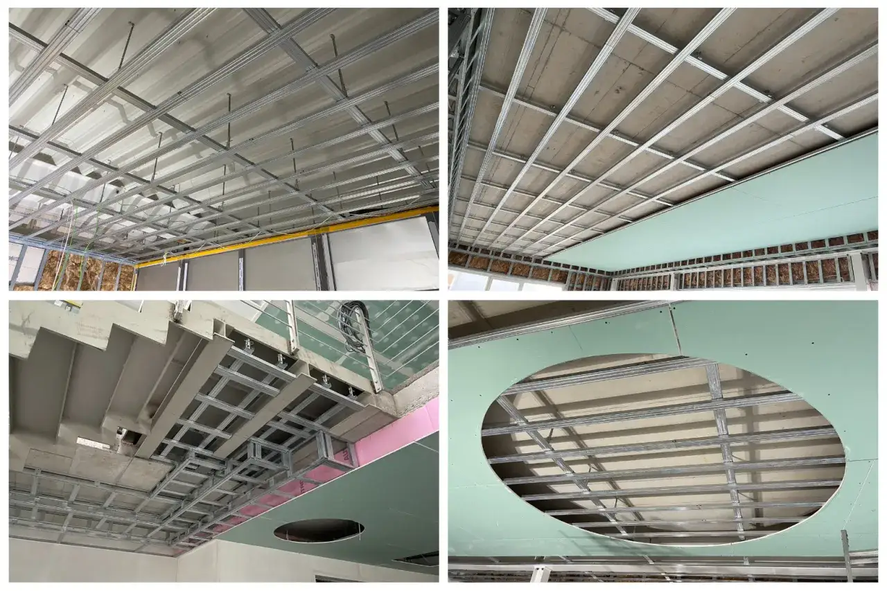 Metallprofile f&uuml;r eine trockenbau decke werden montiert. Gipskartonplatten werden angebracht, teils mit runden Ausschnitten.