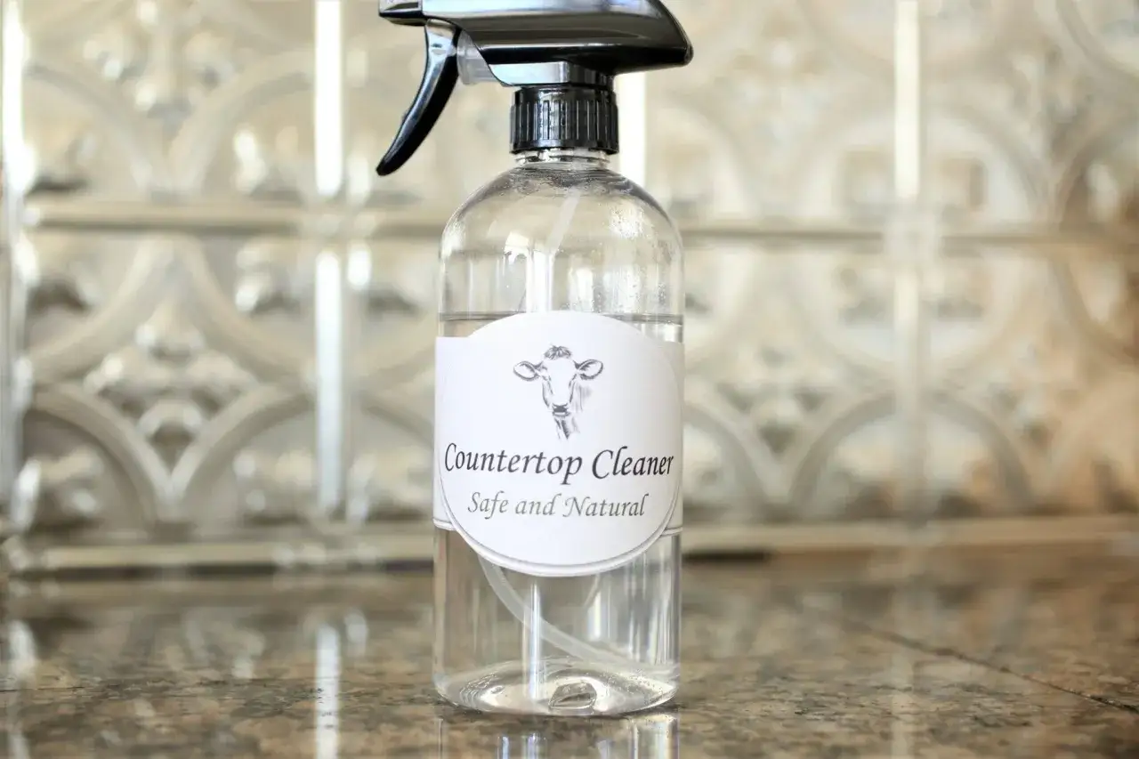 A clear spray bottle labeled 