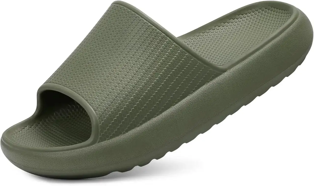 A single olive green slide sandal with a honeycomb texture on the footbed. Learn how to stop slides from squeaking for quiet comfort.