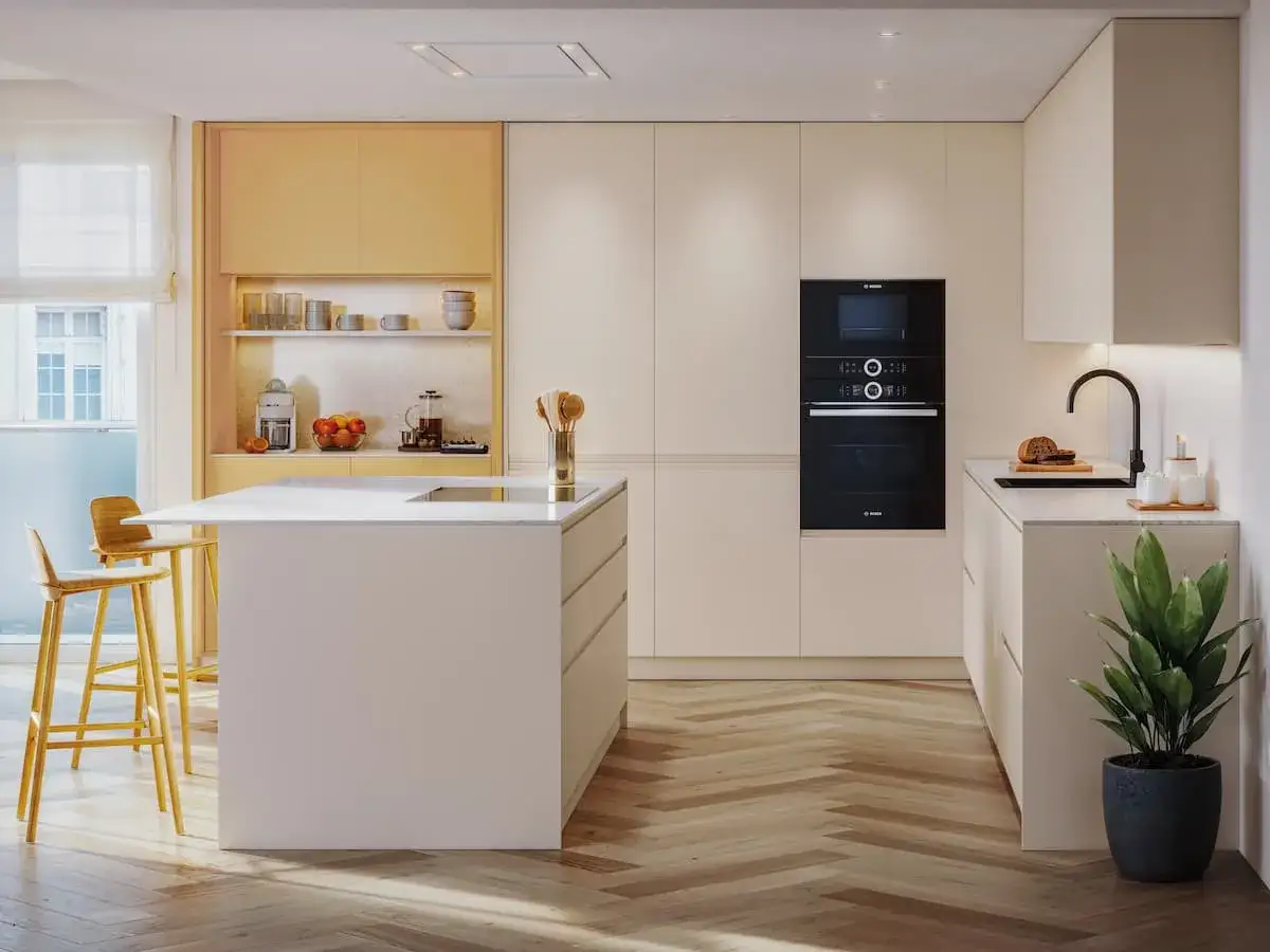 Cocinas modernas con isla central, electrodom&eacute;sticos integrados y c&aacute;lidos colores que invitan a la convivencia.