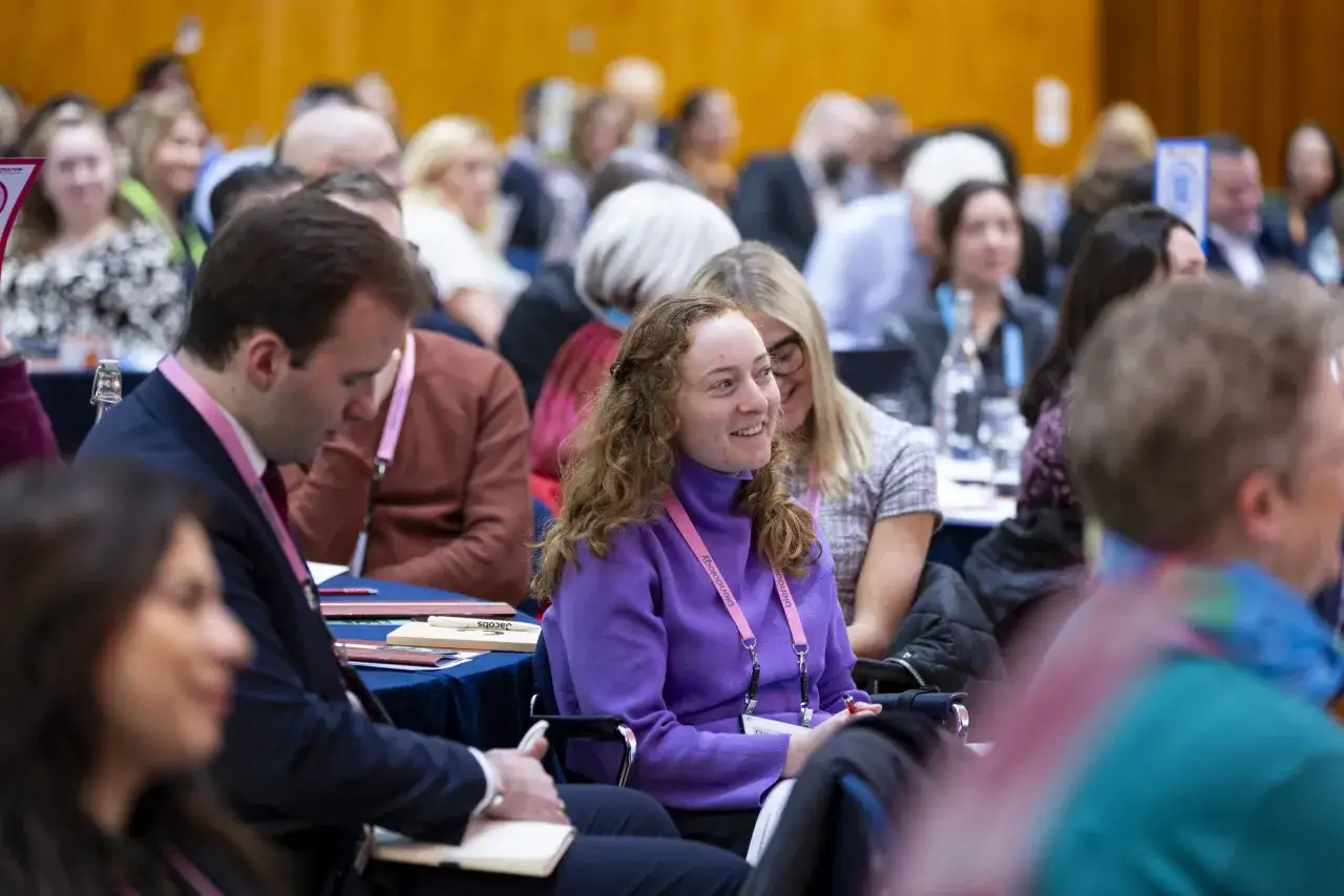Attendees at a conference, fostering government collaboration and knowledge sharing.