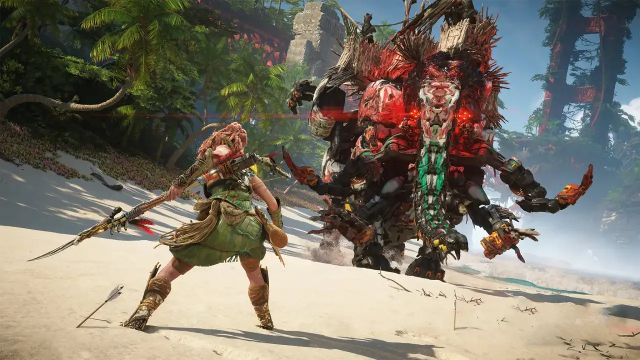 Aloy se enfrenta a una máquina colosal en la playa, un momento épico de Horizon Forbidden West.