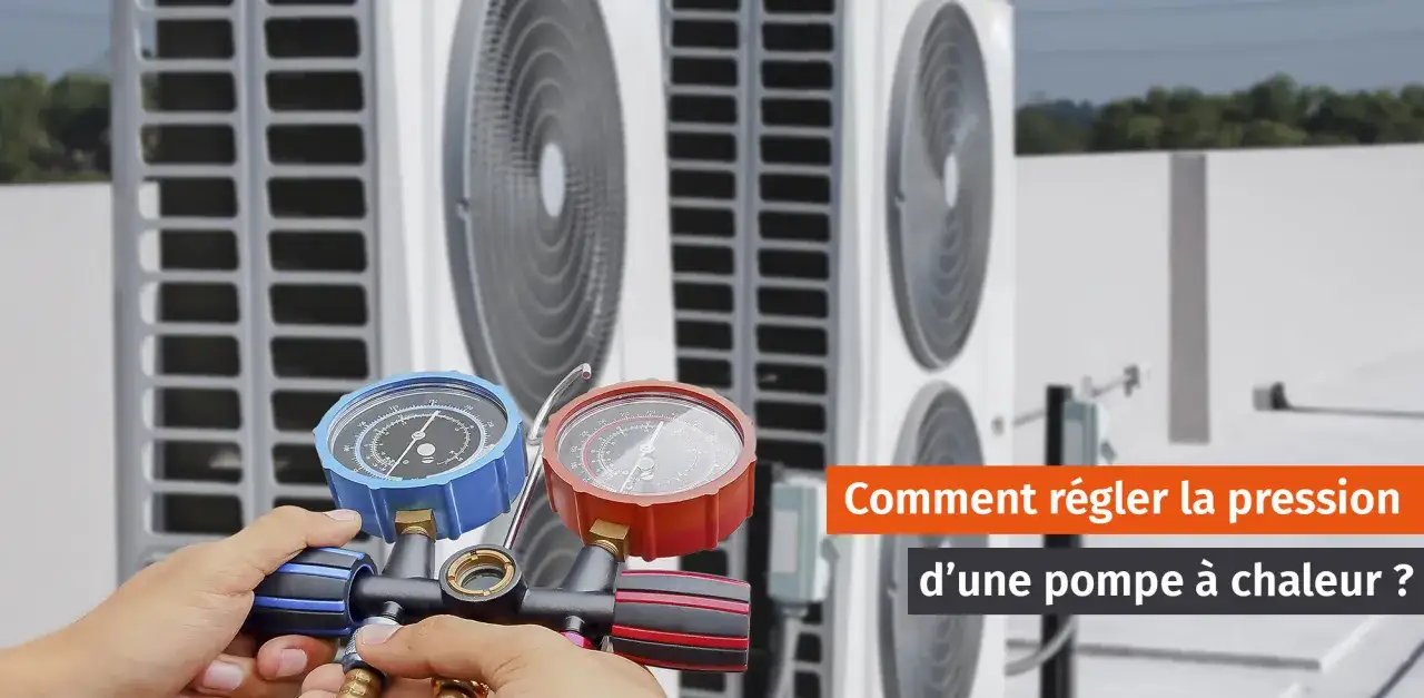 Main d'un technicien ajustant la pression eau pompe &agrave; chaleur avec des manom&egrave;tres.