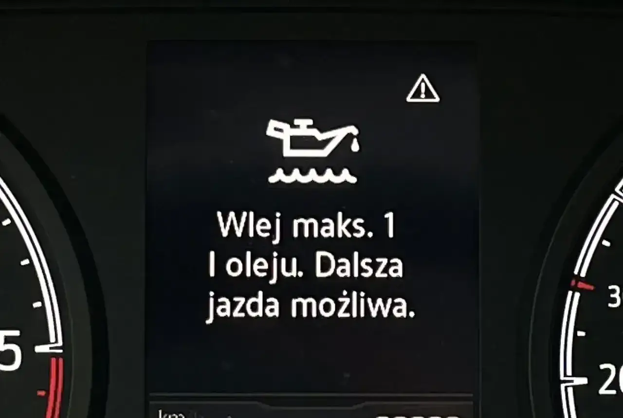 Kontrolka silnika z ikoną oleju i ostrzeżeniem: