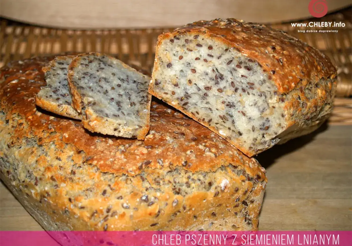Chleb pszenny z siemieniem lnianym, z chrupiącą skórką i widocznymi ziarnami lnu w miękkim wnętrzu. Idealny na zdrowe śniadanie.