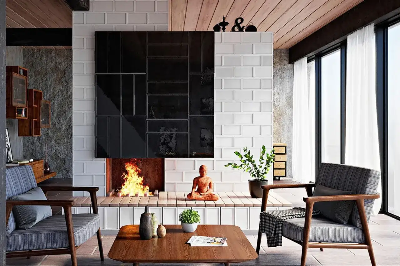 Moderne Kamin Ideen Wohnzimmer: Ein gem&uuml;tliches Wohnzimmer mit Kamin, der mit schwarzen und wei&szlig;en Fliesen verkleidet ist. Ein Buddha sitzt davor.