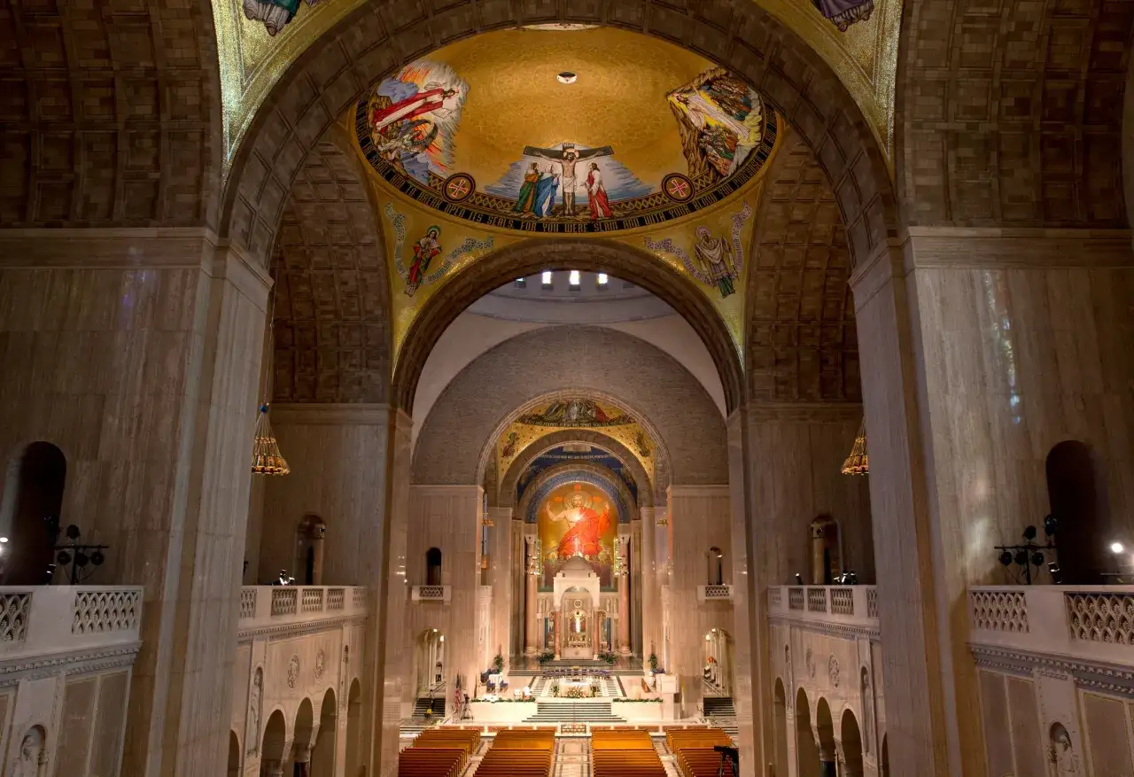 Interior of a grand basilica, showcasing ornate mosaics and architecture, a testament to enduring christian prayer sites.