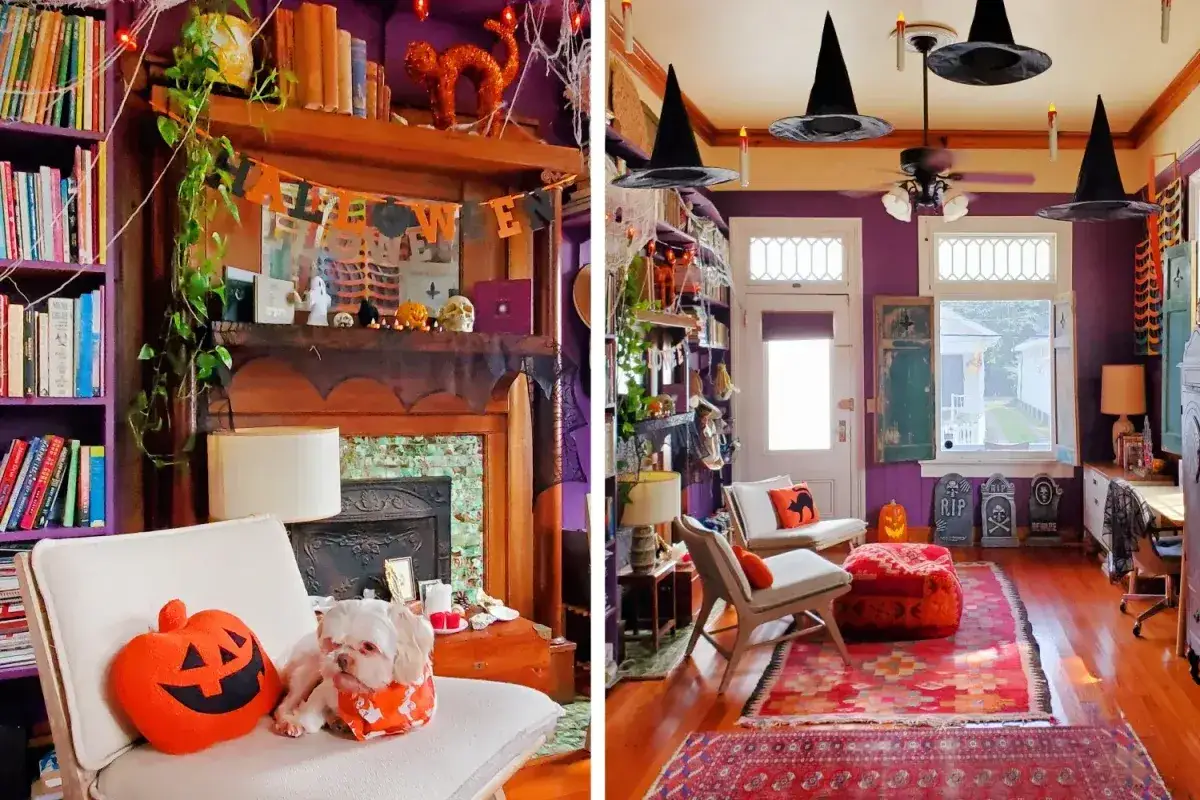 A cozy room decorated for Halloween on the cheap. Witch hats hang from the ceiling, and a dog sits by a pumpkin pillow.