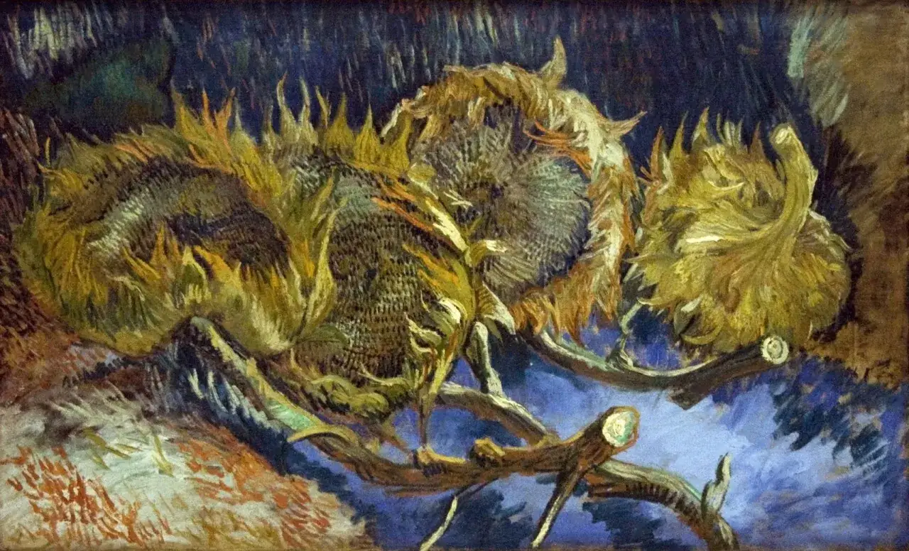 Martwa natura van Gogha: zwiędłe słoneczniki na ciemnym tle, ich żółte płatki opadają, tworząc dramatyczny obraz.