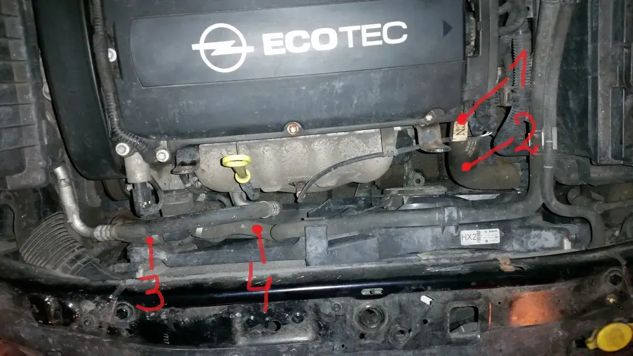Silnik Opel Astra H z widocznym czujnikiem temperatury zewnętrznej.