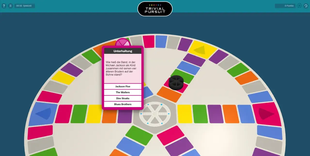 Trivial Pursuit: Aktuelle Fragen im Spiel. Ein Spieler muss erraten, wie die Band hie&szlig;, in der Michael Jackson als Kind mit seinen Br&uuml;dern auftrat.