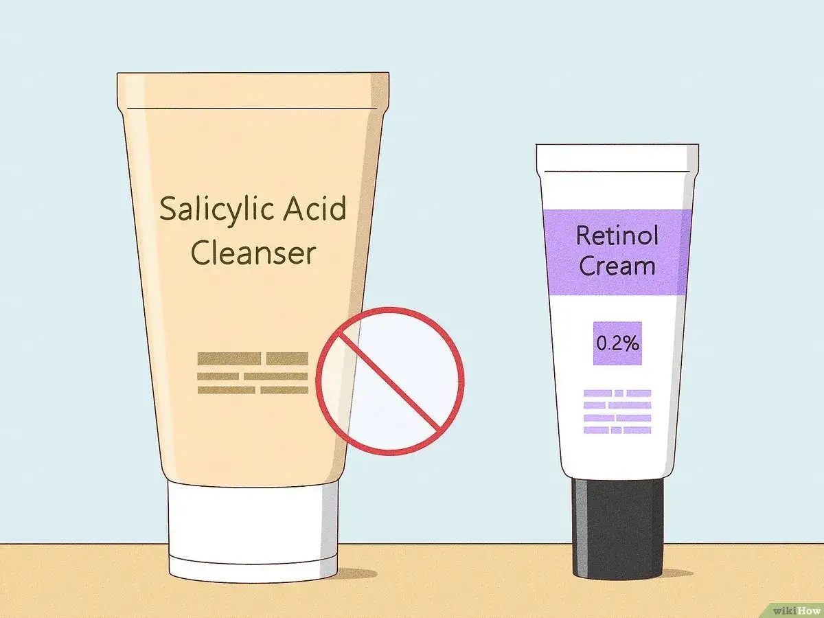 Dos tubos de crema: uno de &aacute;cido salic&iacute;lico con una se&ntilde;al de prohibido, y otro de crema de retinol 0.2%. Aprende como aplicar retinol.