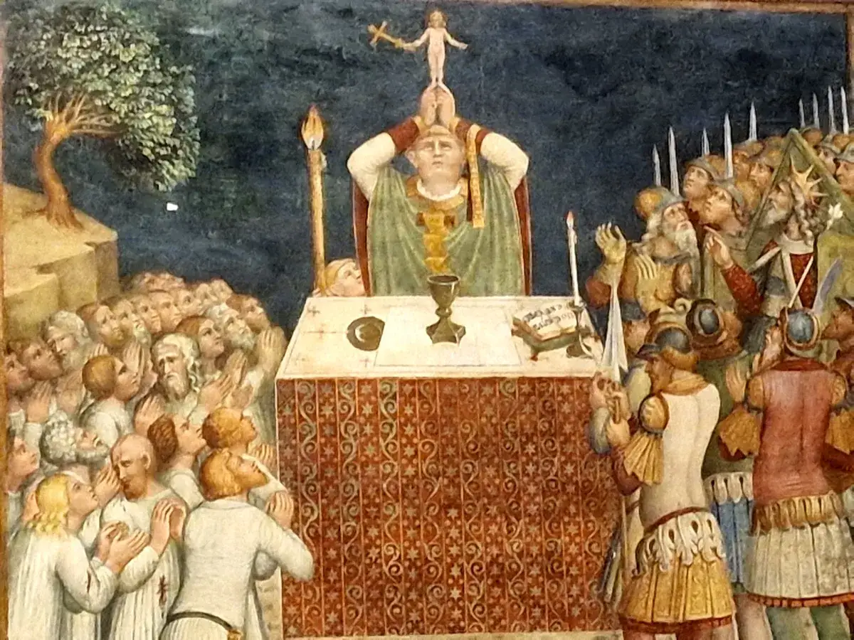 Scena religijna z biskupem podnoszącym relikwię, tłum wiernych i żołnierzy. Obraz ukazuje przyczyny kultu relikwii krwi w kościele katolickim.