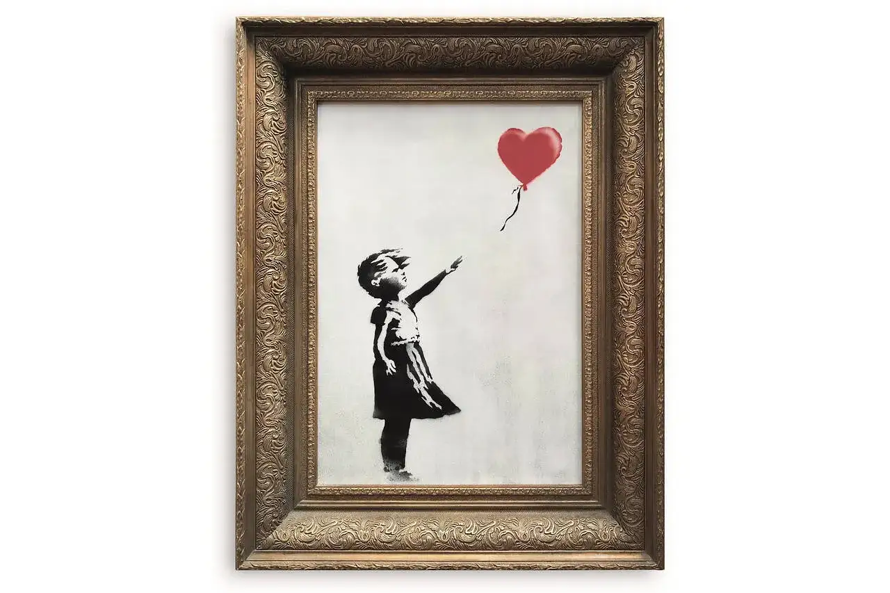 Banksy zniszczenie obrazu: dziewczynka z czerwonym balonem w kształcie serca, kt&oacute;ry ucieka.