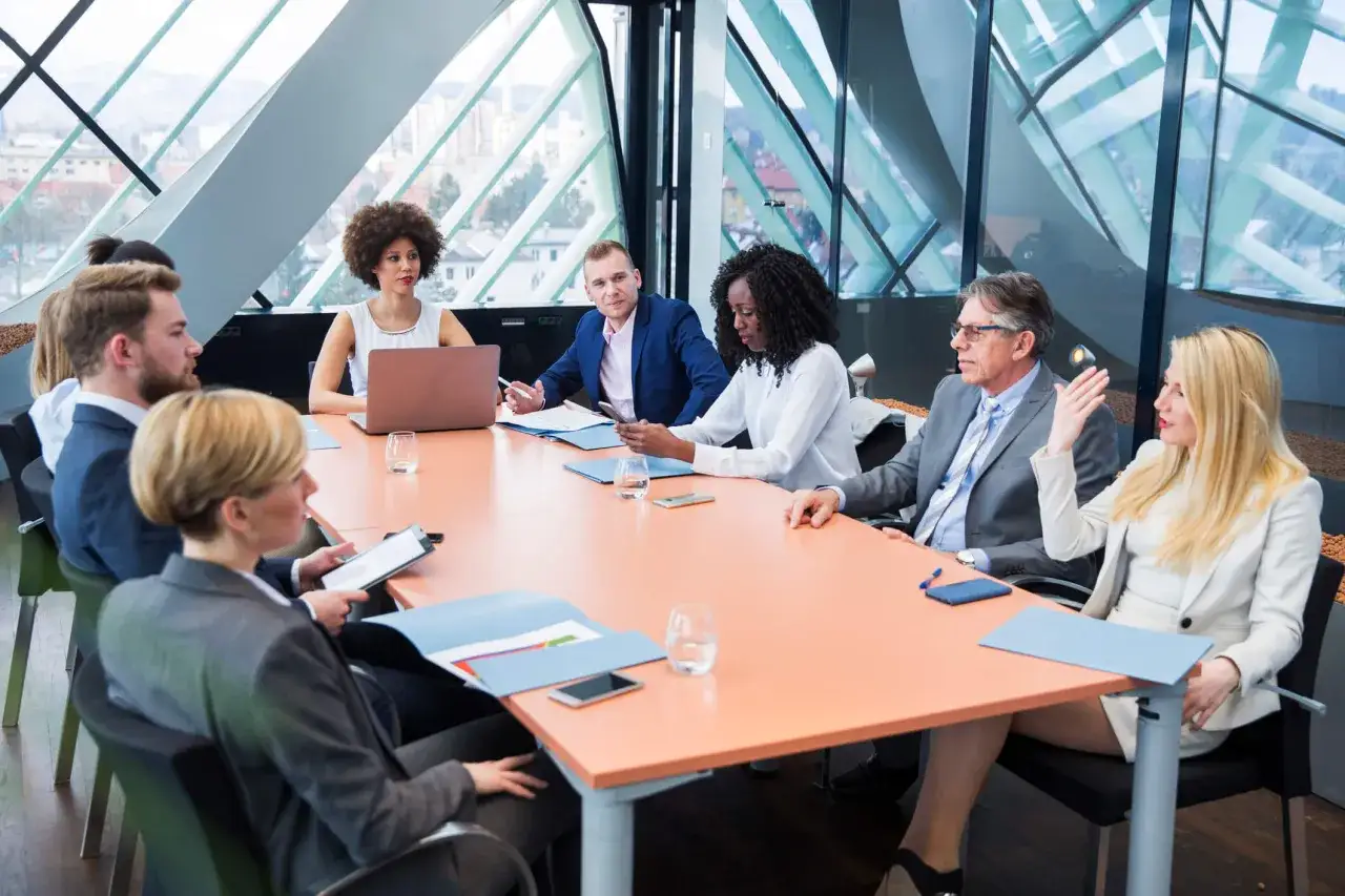 Diverse team in a modern meeting room, discussing nonprofit governance.